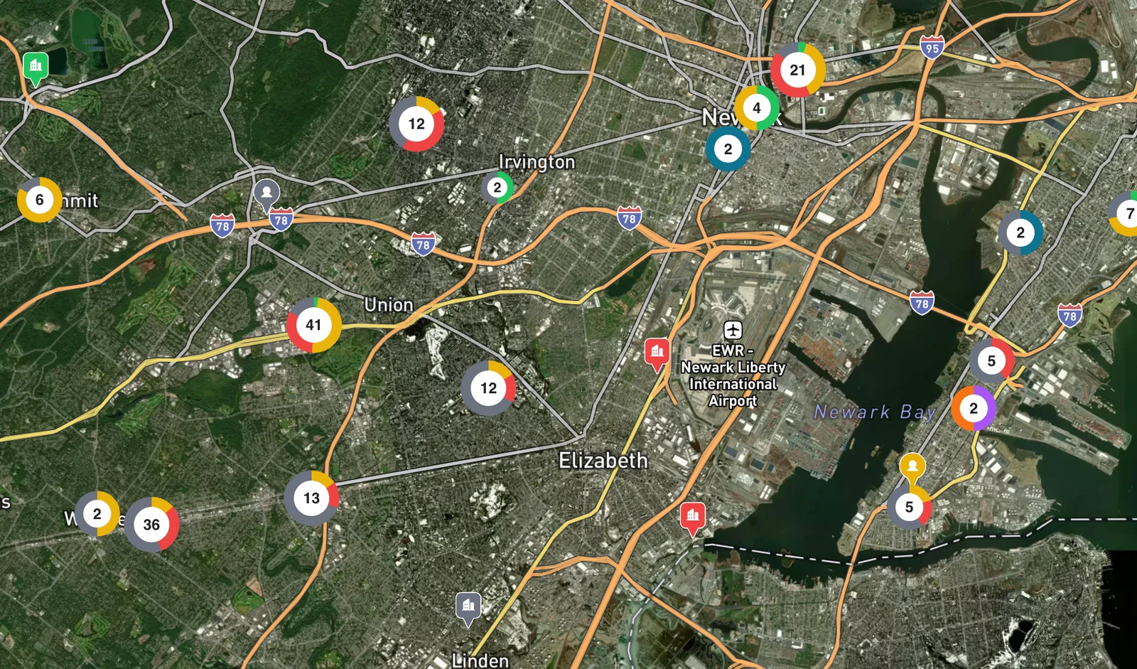 Aerial DealNav map of a metro market with deals, leads, and contacts pinned and clustered by priority